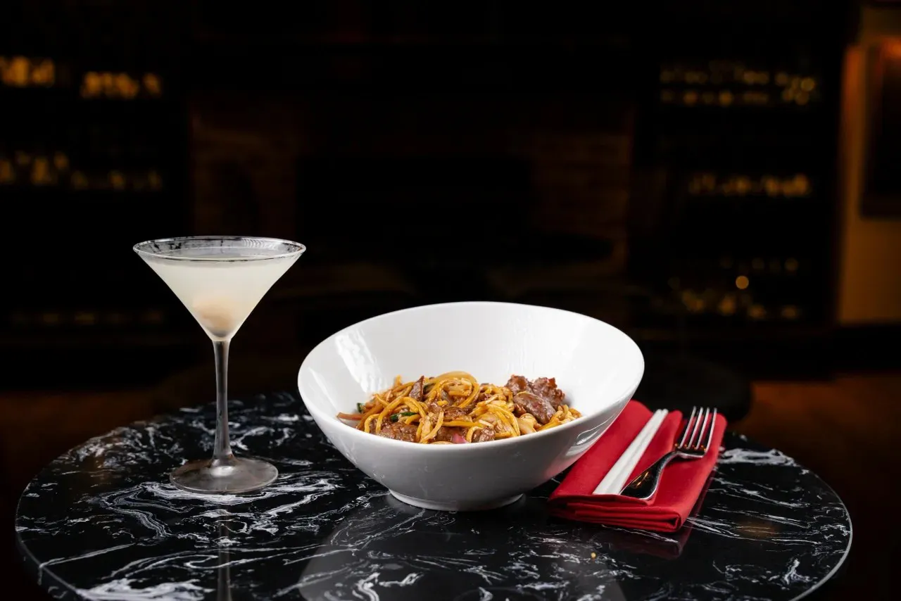 Beef stir-fried noodles paired with martini drink at Shun Lee, a Chinese Restaurant in Lexington