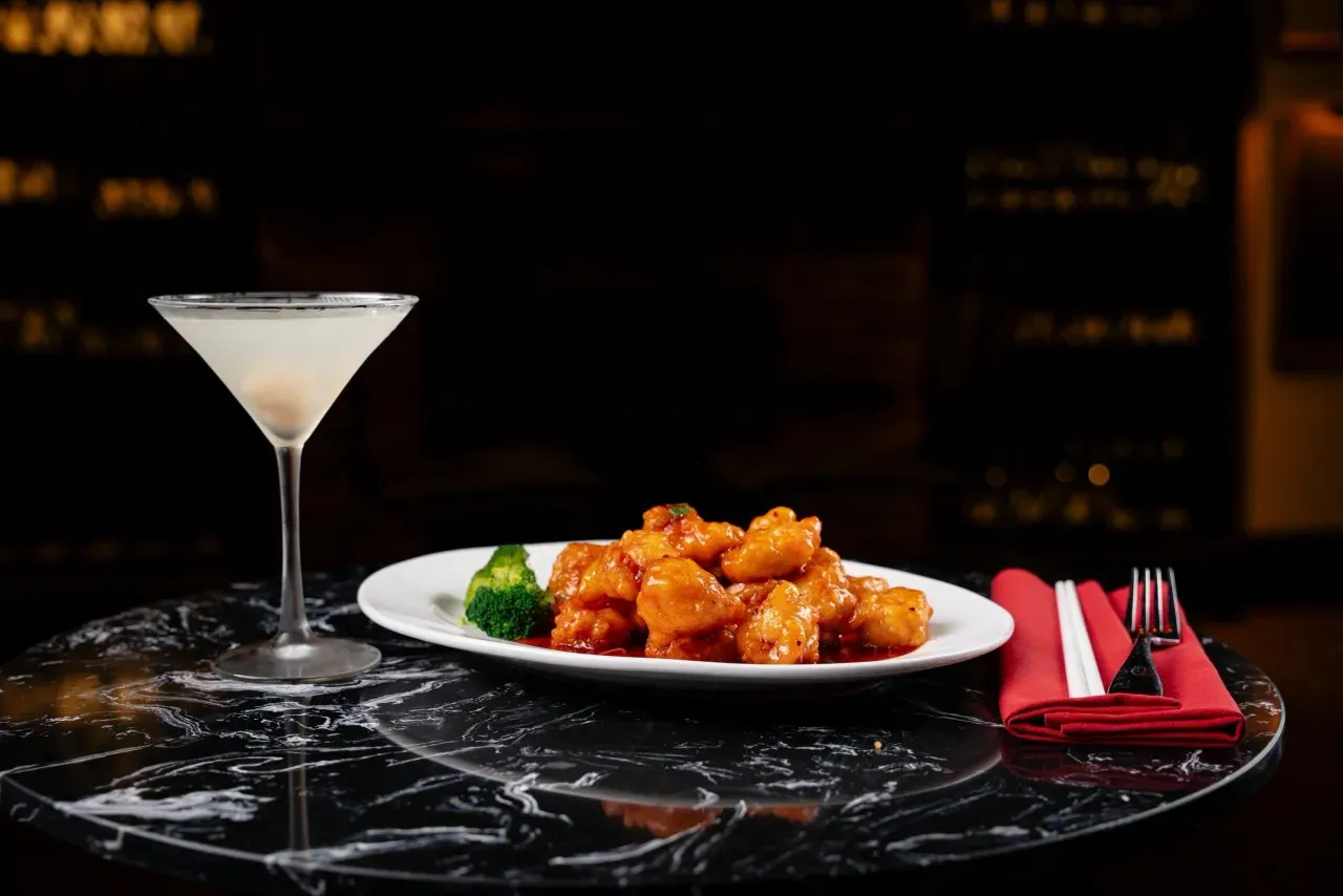 Glazed chicken bites with broccoli and martini cocktail at Shun Lee, a Chinese Restaurant in Lexington